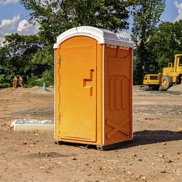 what is the cost difference between standard and deluxe portable restroom rentals in Trion